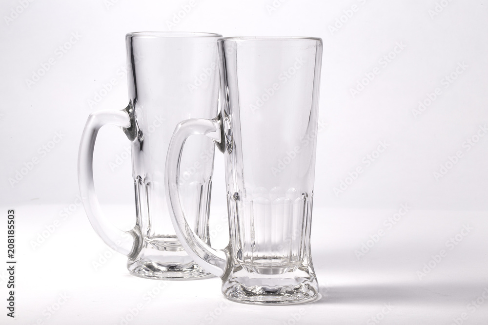 Empty beer glass. Isolated on white background Empty beer glass. Isolated on white background