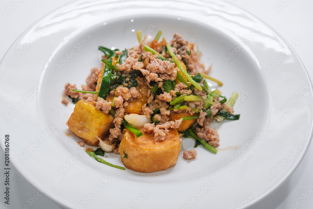 tofu stir fry with pork on white dish tofu stir fry with pork on white dish