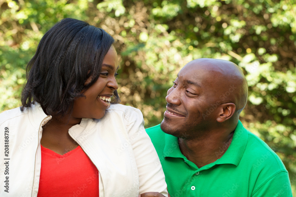 African American Couple talking and laughing.