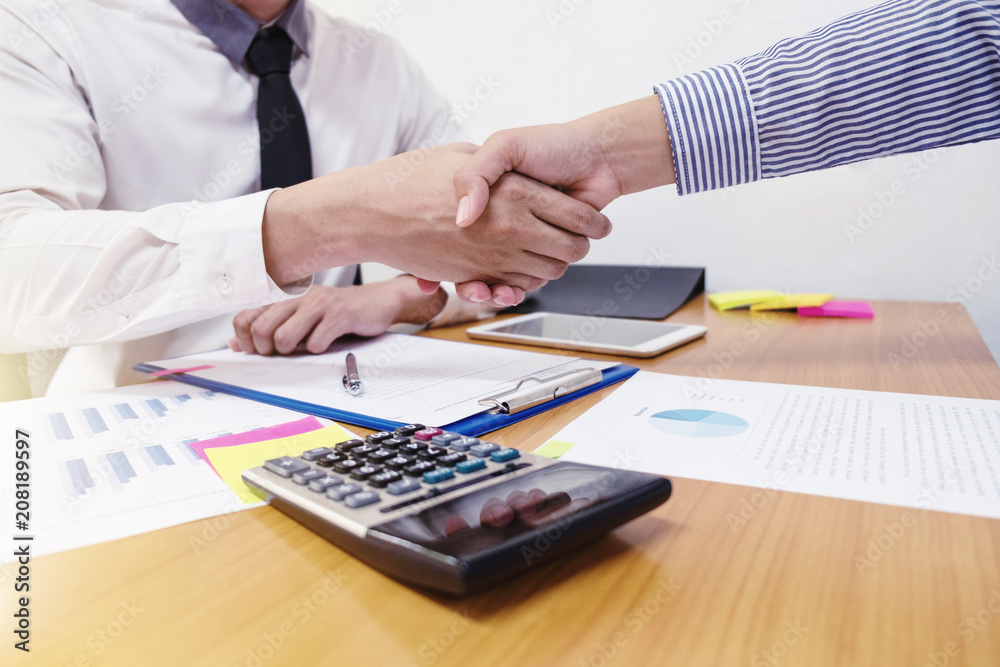 Close-up of two business people shaking hands Close-up of two business people shaking hands