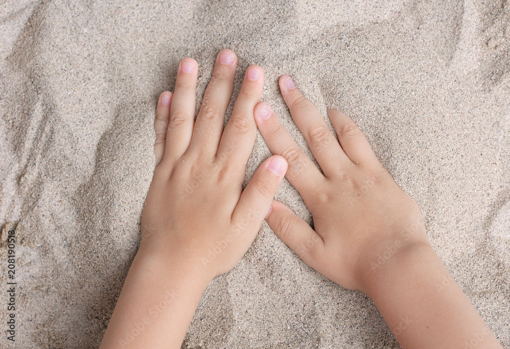 The child is playing with the sea sand. Sypet, flying away. Relax, meditation