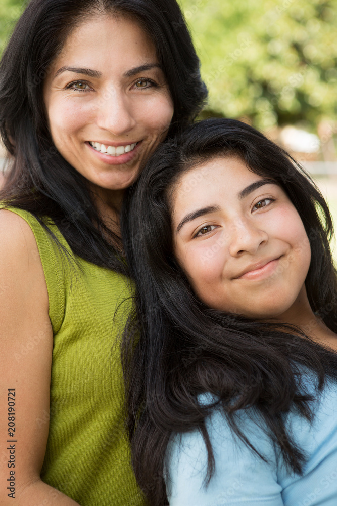 Hispanic mother and daughter. Hispanic mother and daughter.