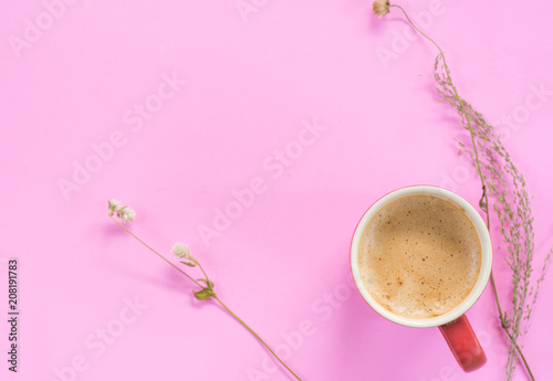 Hot coffee on pank background with dried flower photo