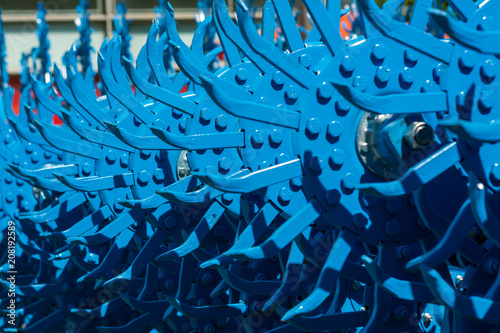 Tablou pe pânză The blocks of the teeth of the rotary harrow are painted blue