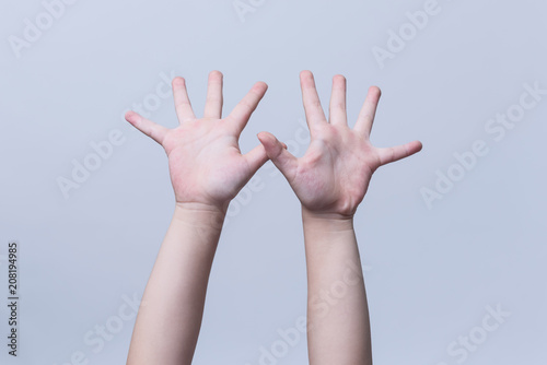 hands of the child isolated on the white background.