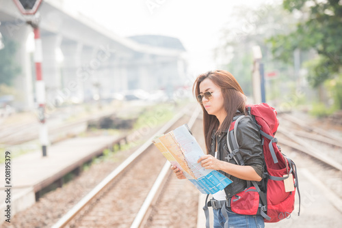 Young beautiful female traveler lost in the city