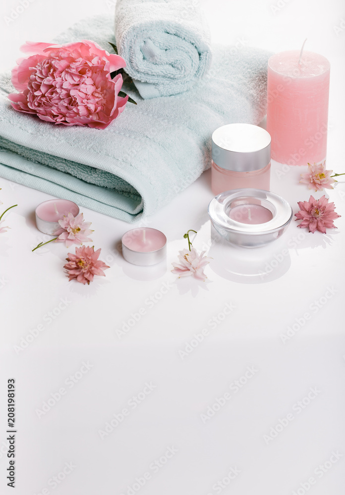 Spa concept in Valentine's Day, Birthday Day, pink peony, candles, blue towels, flowers. Spring or summer background Spa concept in Valentine's Day, Birthday Day, pink peony, candles, blue towels, flowers. Spring or summer background