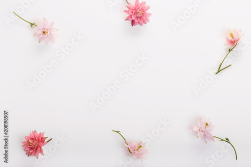 Festive flowers composition on the white background. Overhead top view, flat lay. Copy space. Birthday, Mother's, Valentines, Women's, Wedding Day concept.