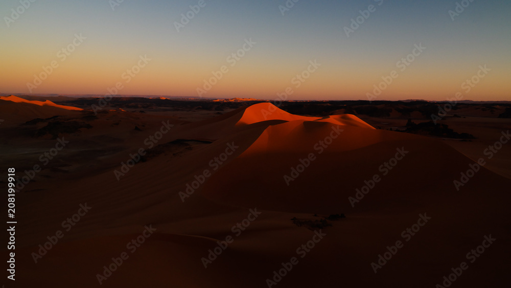 Sunset view to Tin Merzouga dune at Tassili nAjjer national park in Algeria