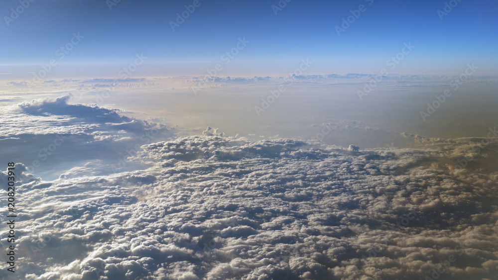 Flying in the sky over the clouds.