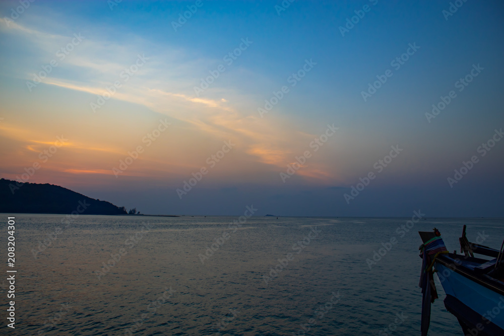 Sunset Behind an Island in the Sea at Koh Phaghan in Suratthani Thailand.