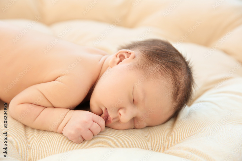 Adorable newborn baby sleeping on bed Adorable newborn baby sleeping on bed