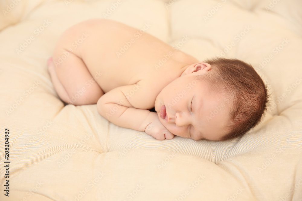 Adorable newborn baby sleeping on bed Adorable newborn baby sleeping on bed
