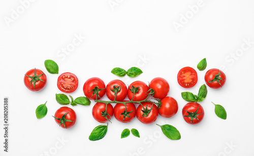 Flat lay composition with ripe tomatoes on light background