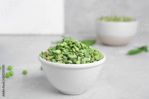 Ceramic bowl with dried peas on table