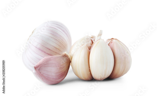 Fresh garlic bulbs and clove on white background