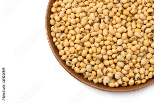 Soybeans in bowl isolated on white background. top view