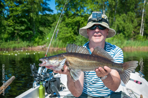Angler with june caught walleye