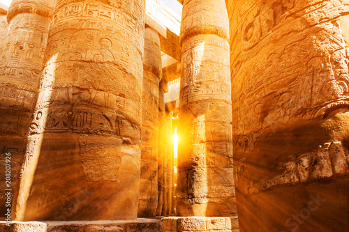 A sandstone column in Egypt.  columns covered in hieroglyphics