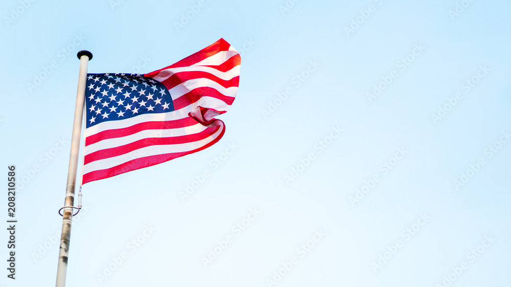 Obraz premium USA flag fluttering on the wind. American holidays banner.