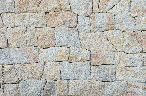 Closeup surface brick pattern at old stone brick wall textured background