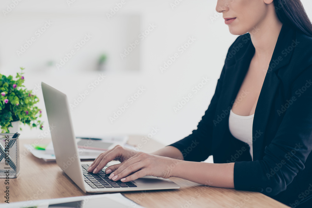 Cropped portrait of busy hardworking woman holding hands on keypad texting surfing analyzing expertising working on project start up in work place Cropped portrait of busy hardworking woman holding hands on keypad texting surfing analyzing expertising working on project start up in work place