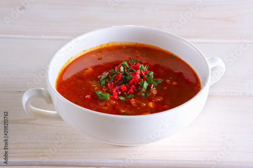 Plate of gazpacho on wooden table