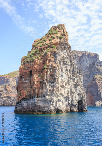 Aeolian Islands in the Tyrrhenian Sea, near Sicily. Rocky, lava-formed picturesque and rough shores of the Lipari island  photo