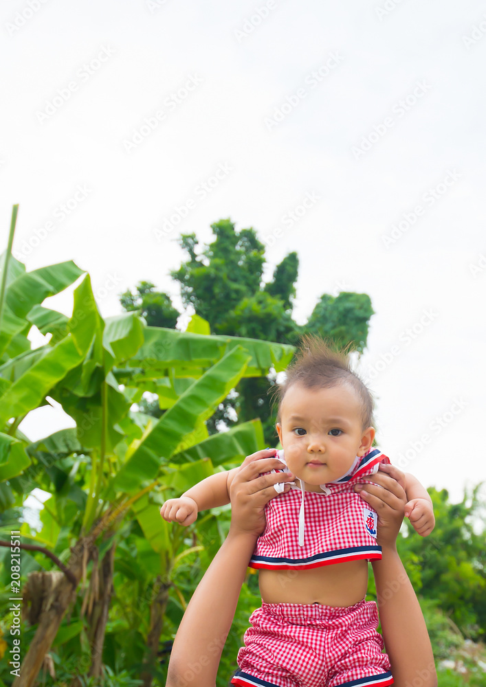 Hand boy brother holding Asian girl sister Hand boy brother holding Asian girl sister