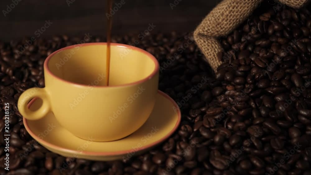 Pouring black coffee inside cup Slow motion Pouring black coffee inside cup Slow motion