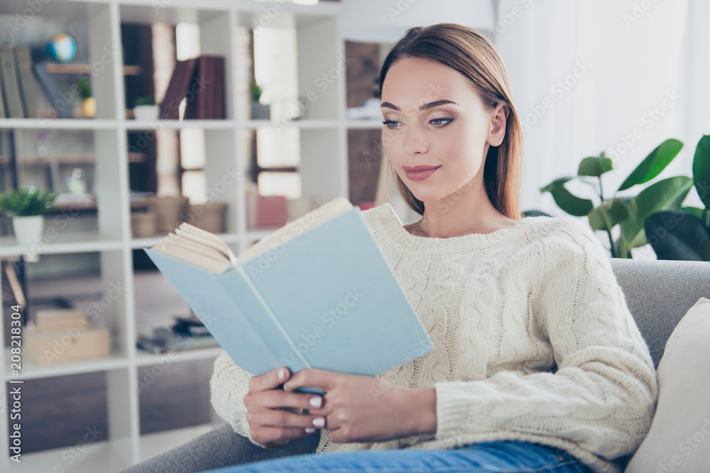 Portrait of smart trendy holding best-seller in hands reading detective story enjoying literature home library learning poem getting inspiration Portrait of smart trendy holding best-seller in hands reading detective story enjoying literature home library learning poem getting inspiration