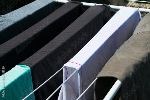 Laundry line with clothes outdoors photo