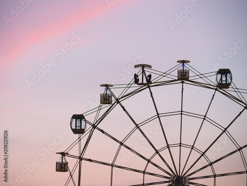 Ferris wheel at sky background right side composition