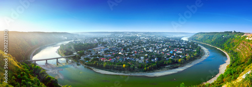 Beautiful evening summer panoramic view of Zalishchyky or Zalischiki  evening view of the town on the bank of the Dniester River meander around city. The province of Bukovina. Ternopil region. Ukraine