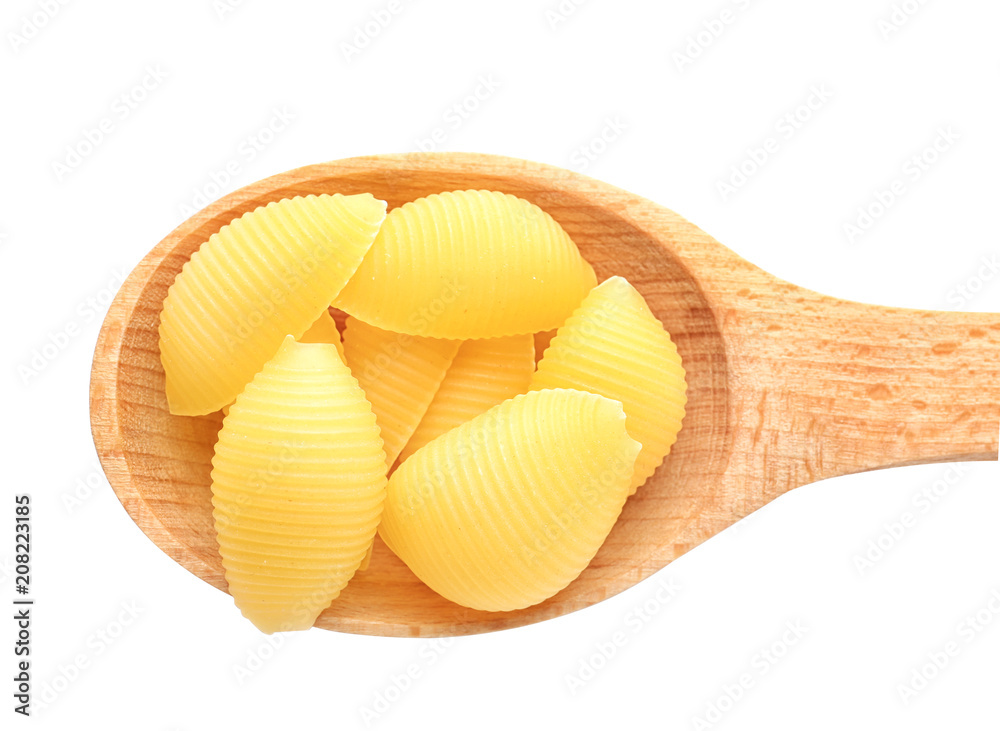 Wooden spoon with raw pasta on white background Wooden spoon with raw pasta on white background
