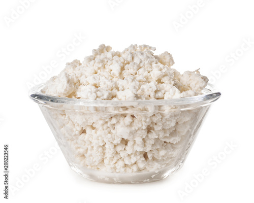 Bowl with tasty cottage cheese on white background