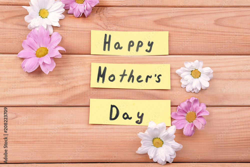 Festive composition with text HAPPY MOTHER'S DAY on wooden background Festive composition with text HAPPY MOTHER'S DAY on wooden background