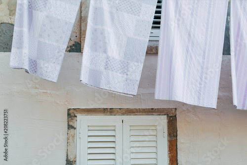 close up view of laundry against light building wall in Dubrovnik, Croatia