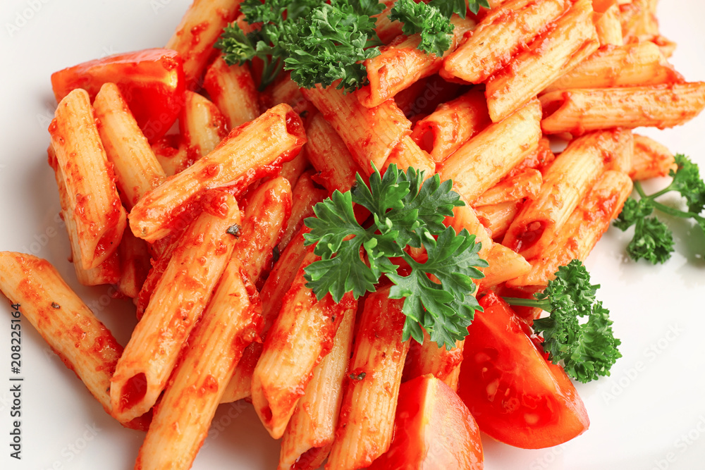 Tasty pasta with tomato sauce on plate, closeup Tasty pasta with tomato sauce on plate, closeup
