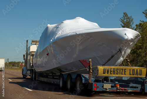  Transportation of a pleasure boat, yacht by car on the highway.