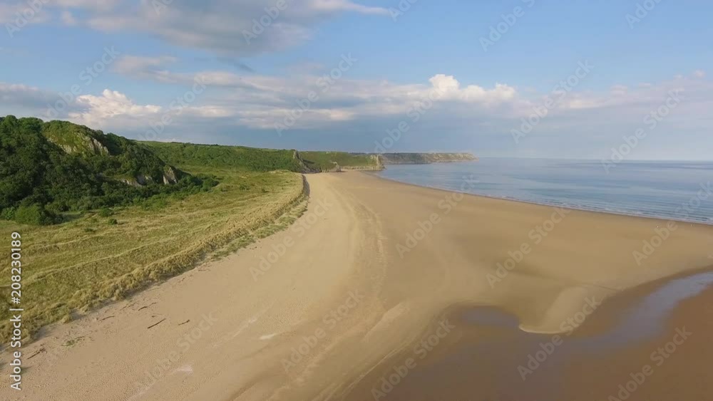 Oxwich Bay on the Gower peninsula in Swansea, UK, a long sweeping sandy bay with a shallow water line with easy access by road from Swansea attracts visitors from all over the UK
Oxwich Bay on the Gower peninsula in Swansea, UK, a long sweeping sandy bay with a shallow water line with easy access by road from Swansea attracts visitors from all over the UK