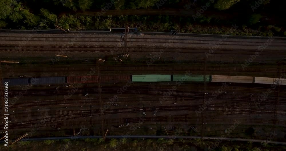 The railway at sunset. Running train. The railway at sunset. Running train.