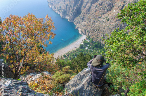 The tourist looks at the valley of the butterflies from hill. Turkey photo