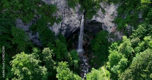 drone flight over giant big waterfall called Wildensteiner waterfall in austria photo