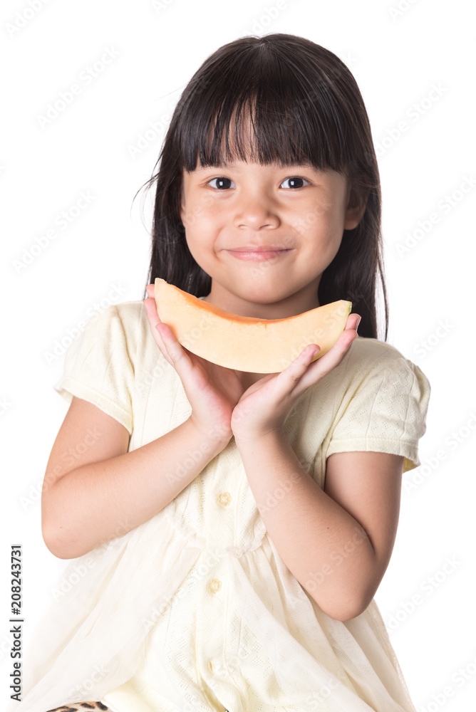 preschool age little girl eating a slice of cantaloupe preschool age little girl eating a slice of cantaloupe