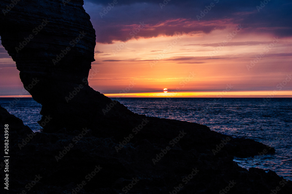 tranquil shot of rocky cliff on cloudy sunset, Etretat, France