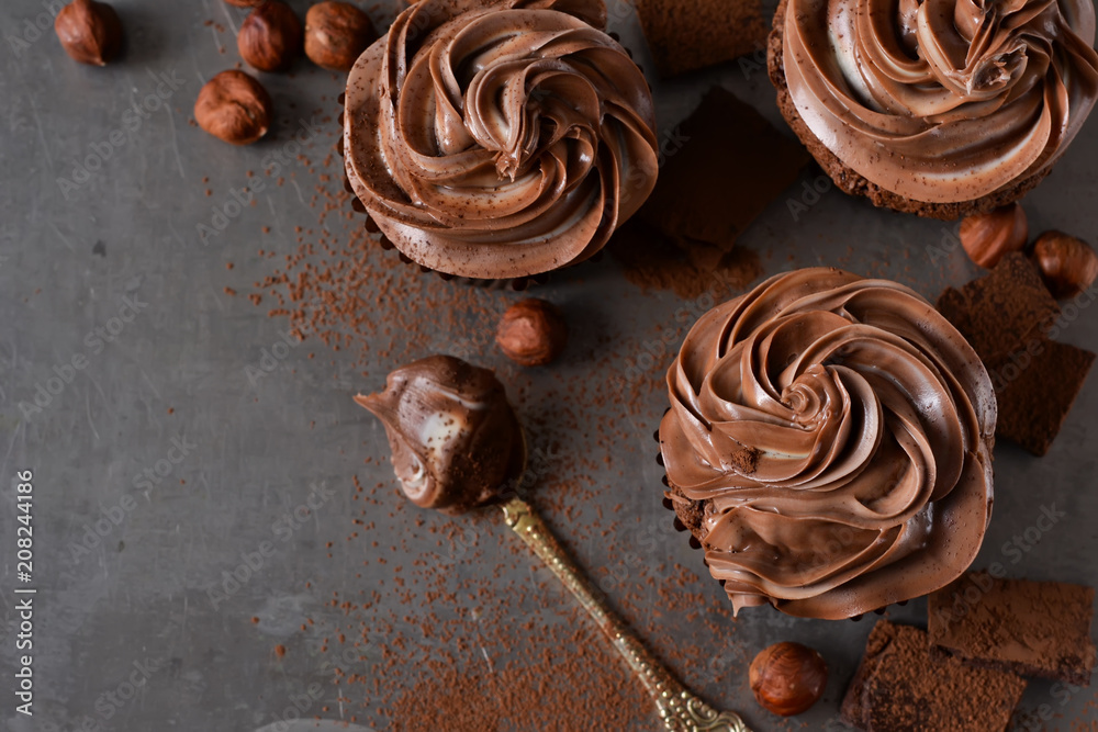 Chocolate cupcakes with peanut paste the old grunge background Chocolate cupcakes with peanut paste the old grunge background