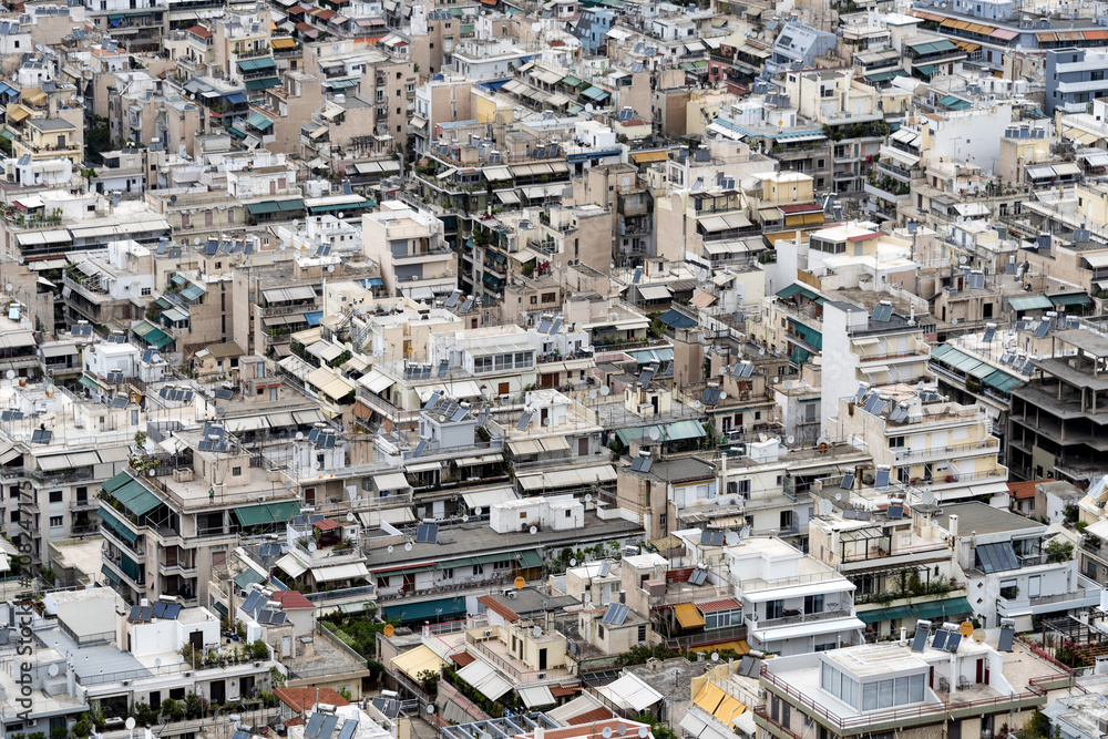 Greece, Athens: Skyline with mass of houses, buildings, apartments, rooftops in the city center of Greek capital - concept urban development town planning structure living condition. April 26, 2018