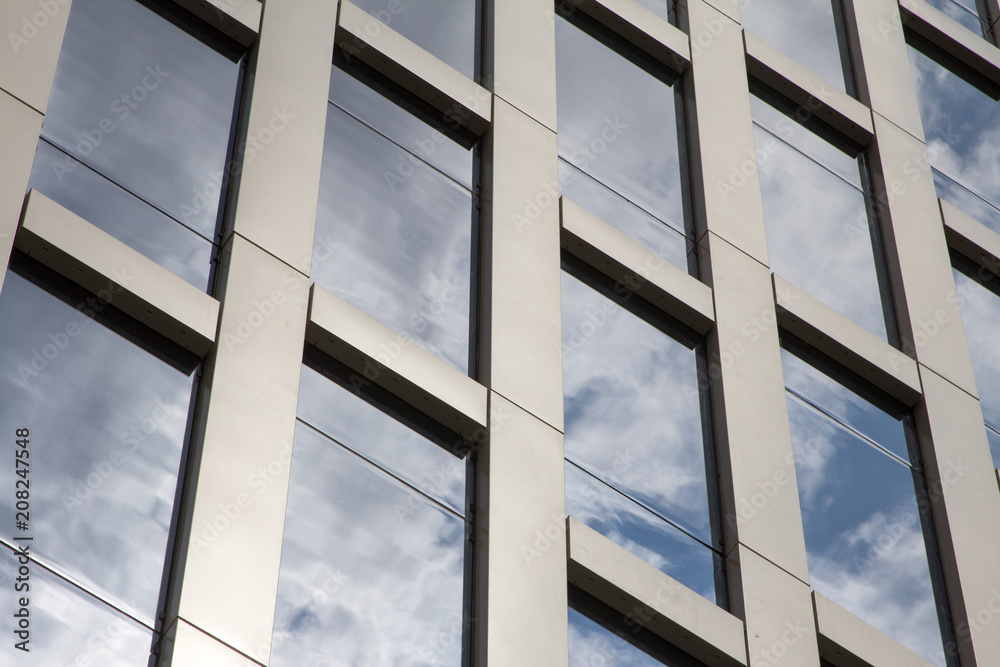 reflection of clouds in the skyscraper windows reflection of clouds in the skyscraper windows