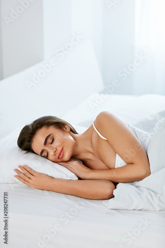 White Bedding. Woman Sleeping On Mattress With Pillow.